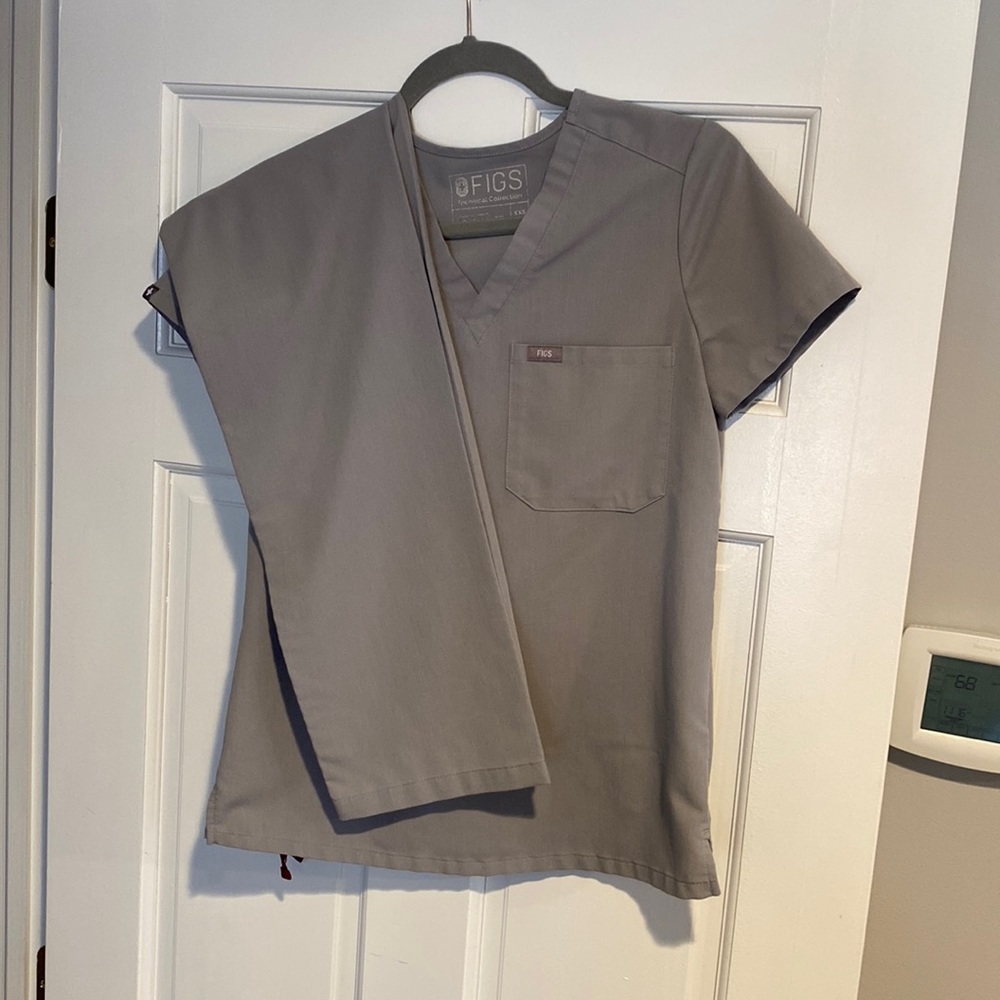 Figs scrubs! Grey in color. Used but in perfect condition. Both size XXS.